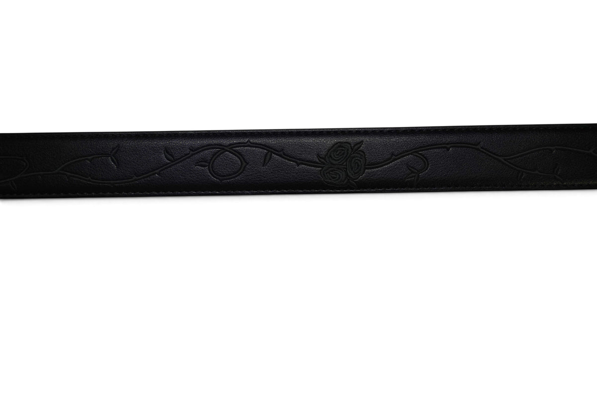 VASANA black premium leather belt featuring a delicate engraved rose vine pattern along the strap.