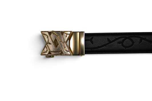 VASANA black leather belt featuring an engraved rose vine pattern and a gold automatic ratchet buckle