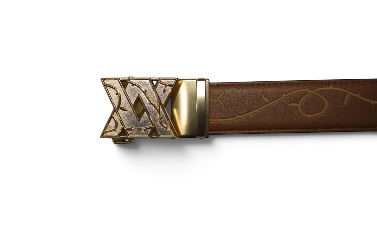 VASANA brown premium leather belt featuring an engraved rose vine pattern and a gold-toned automatic buckle.