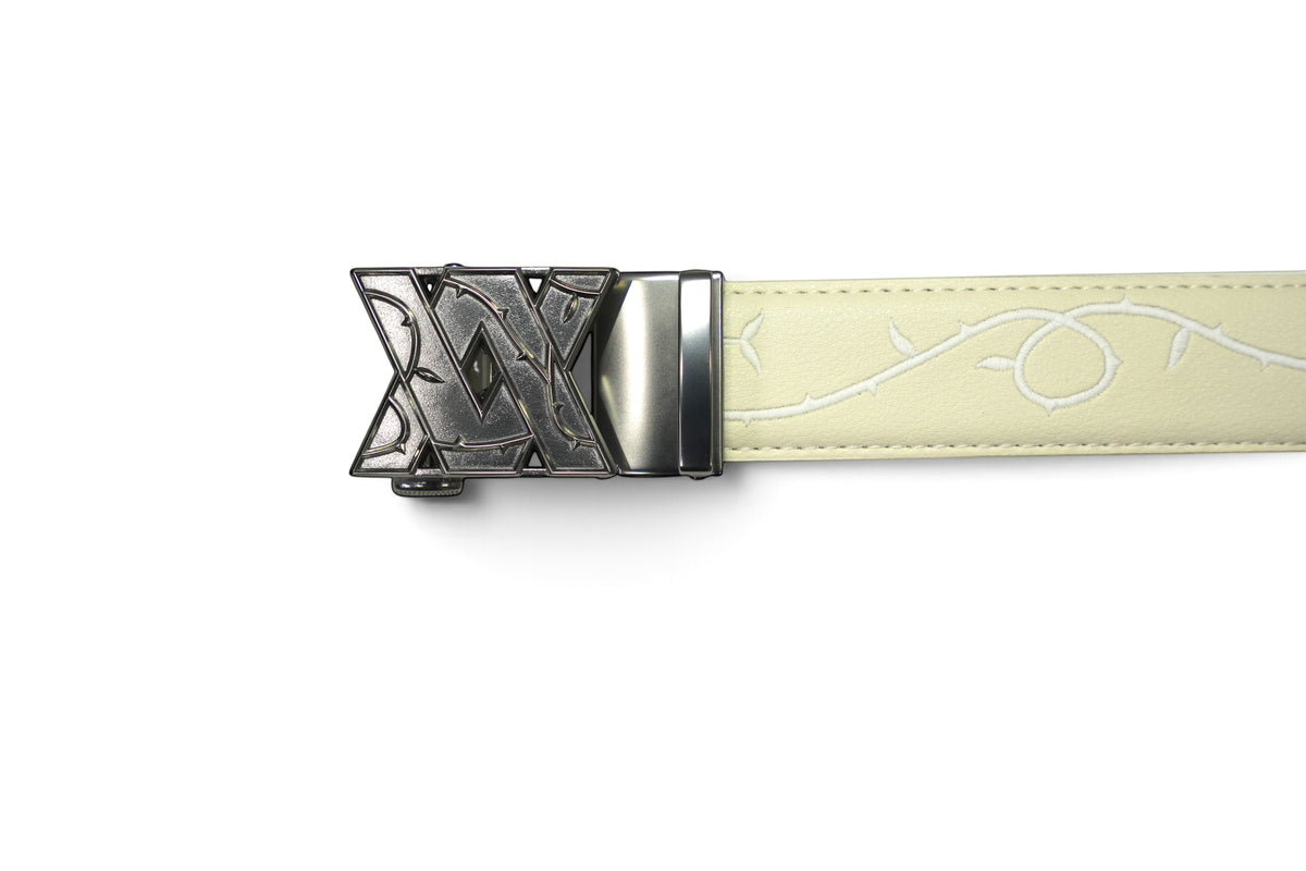 VASANA cream leather belt featuring an intricate white embroidered floral vine pattern and a dark metal buckle